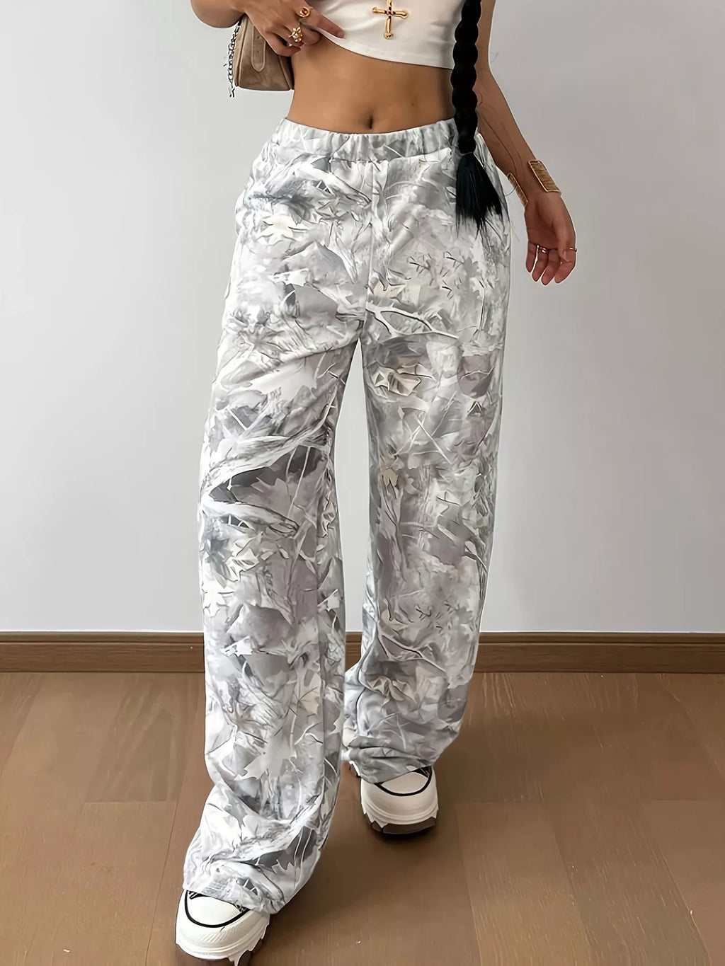 Woman wearing abstract camo pocketed wide leg pants