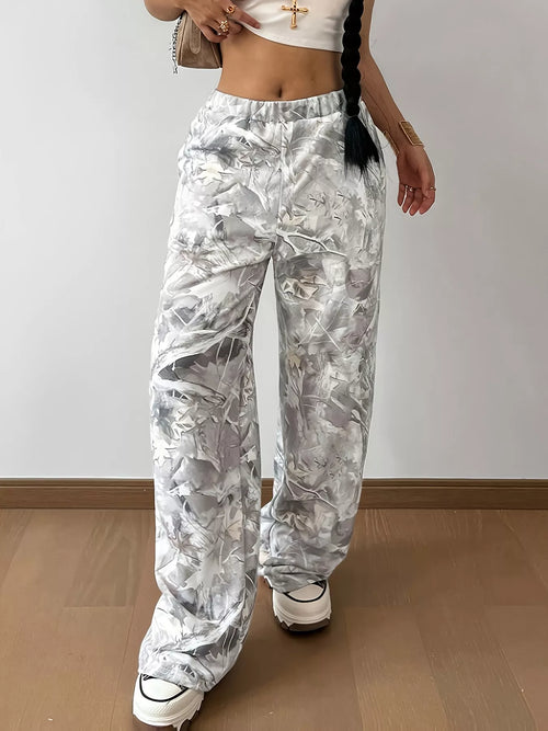 Woman wearing abstract camo pocketed wide leg pants