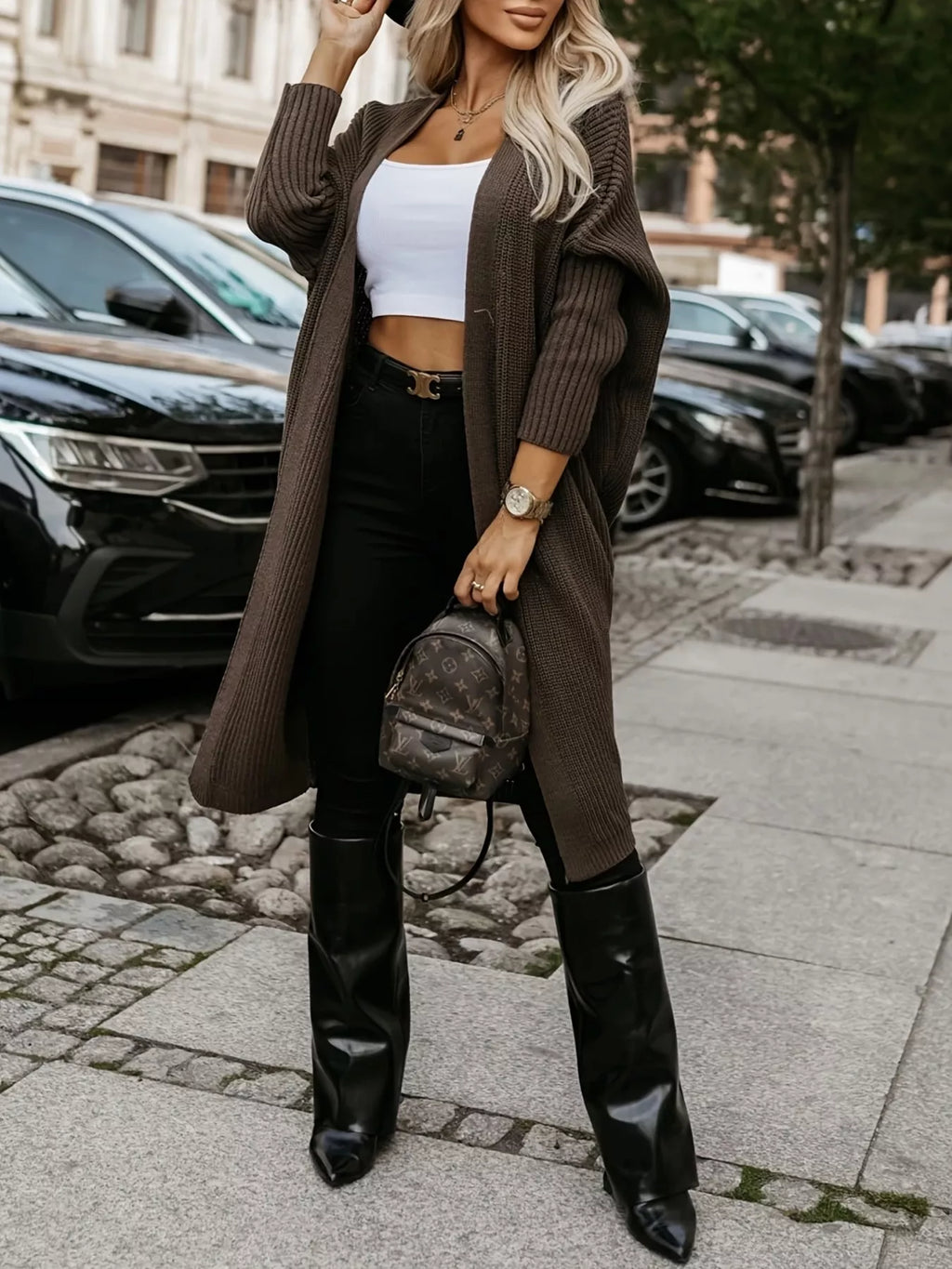 woman wearing a chocolate color longline knit cardigan