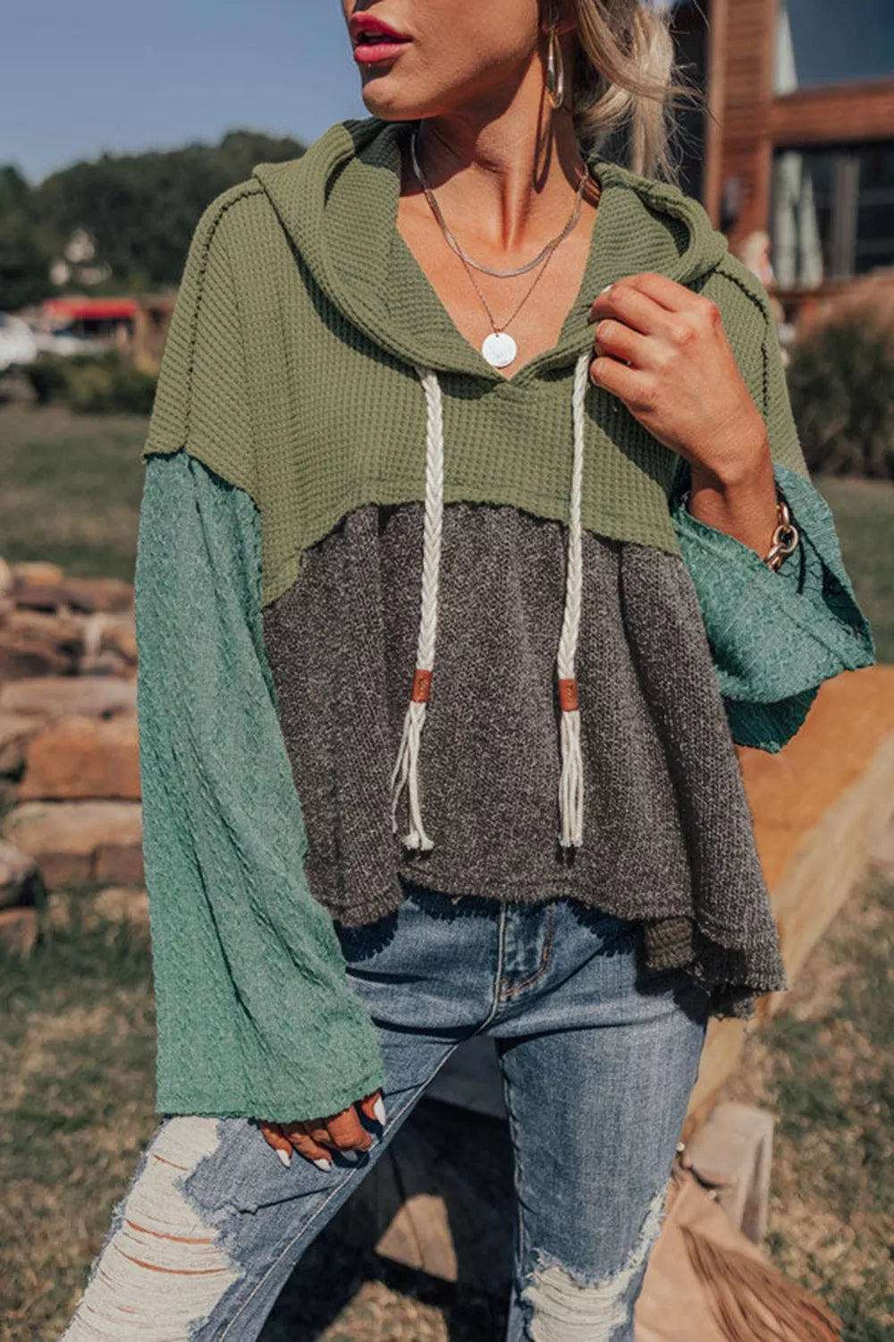 Woman Wearing A Color Block Waffle Knit Hoodie