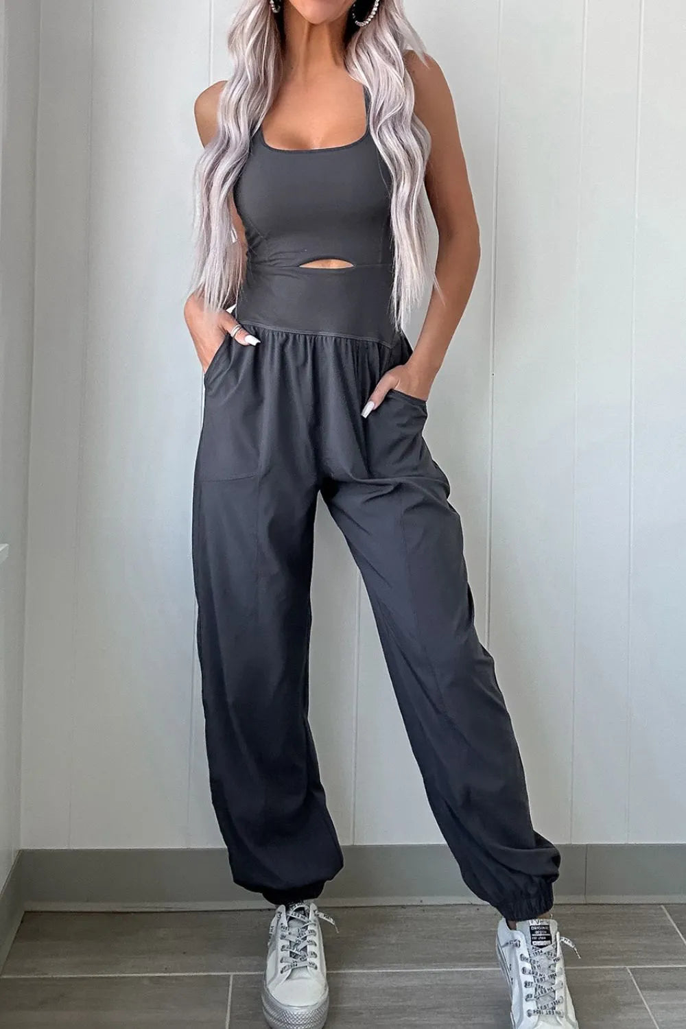 woman wearing a cutout sculpt activewear jumpsuit