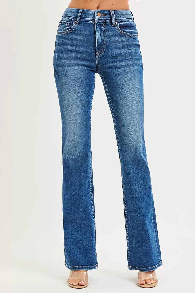 Woman wearing distressed bootcut jeans