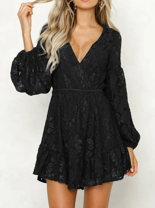 Woman wearing a  Lace V-Neck Long Sleeve Mini Dress