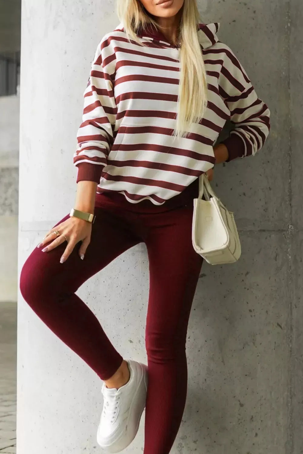 Woman wearing a striped hoodie and leggings set