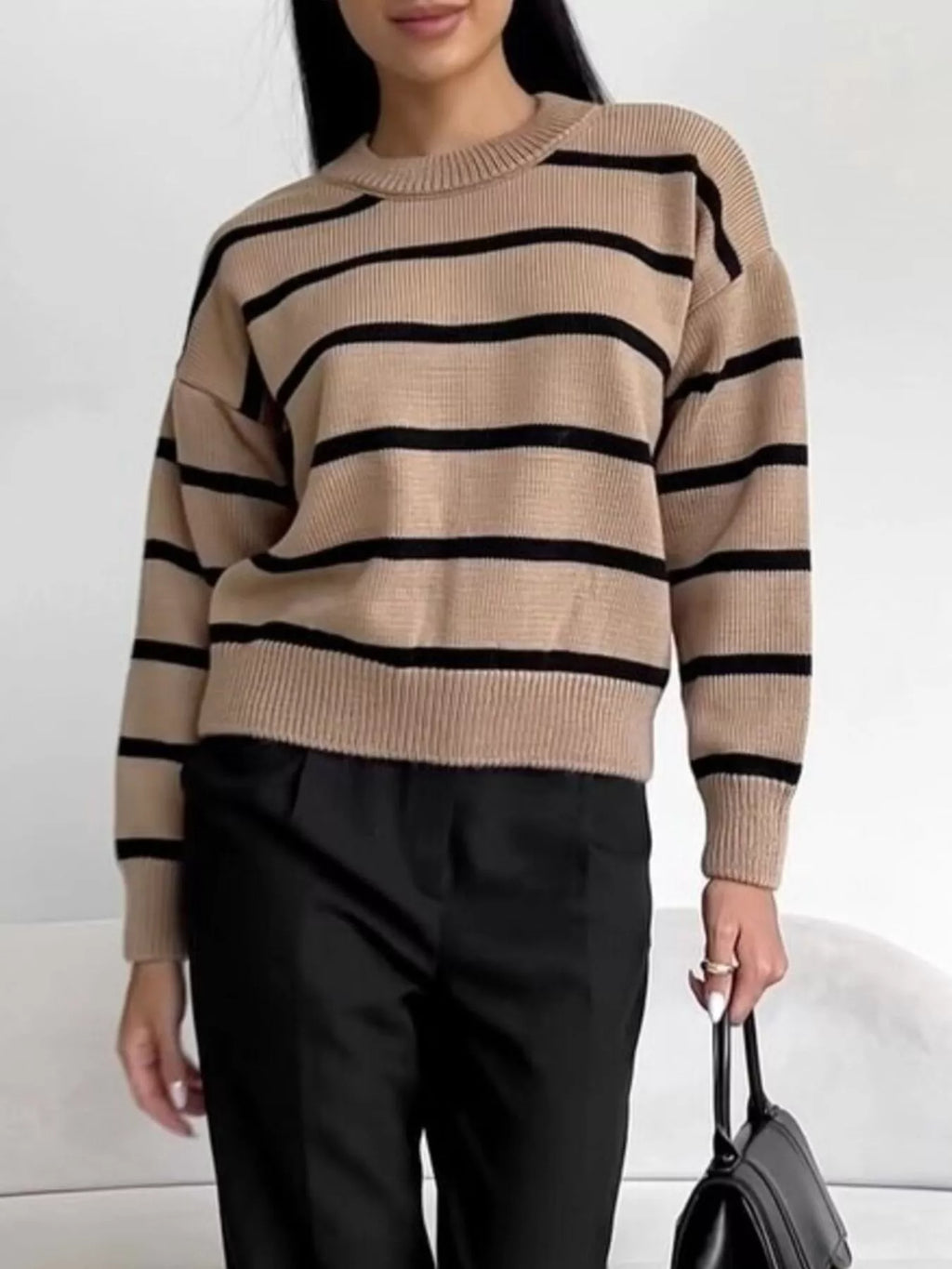 Woman wearing a Neutral Striped Knit Round Neck Sweater