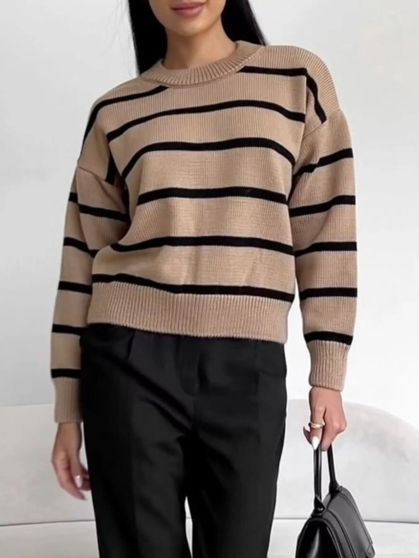 Woman wearing a Neutral Striped Knit Round Neck Sweater