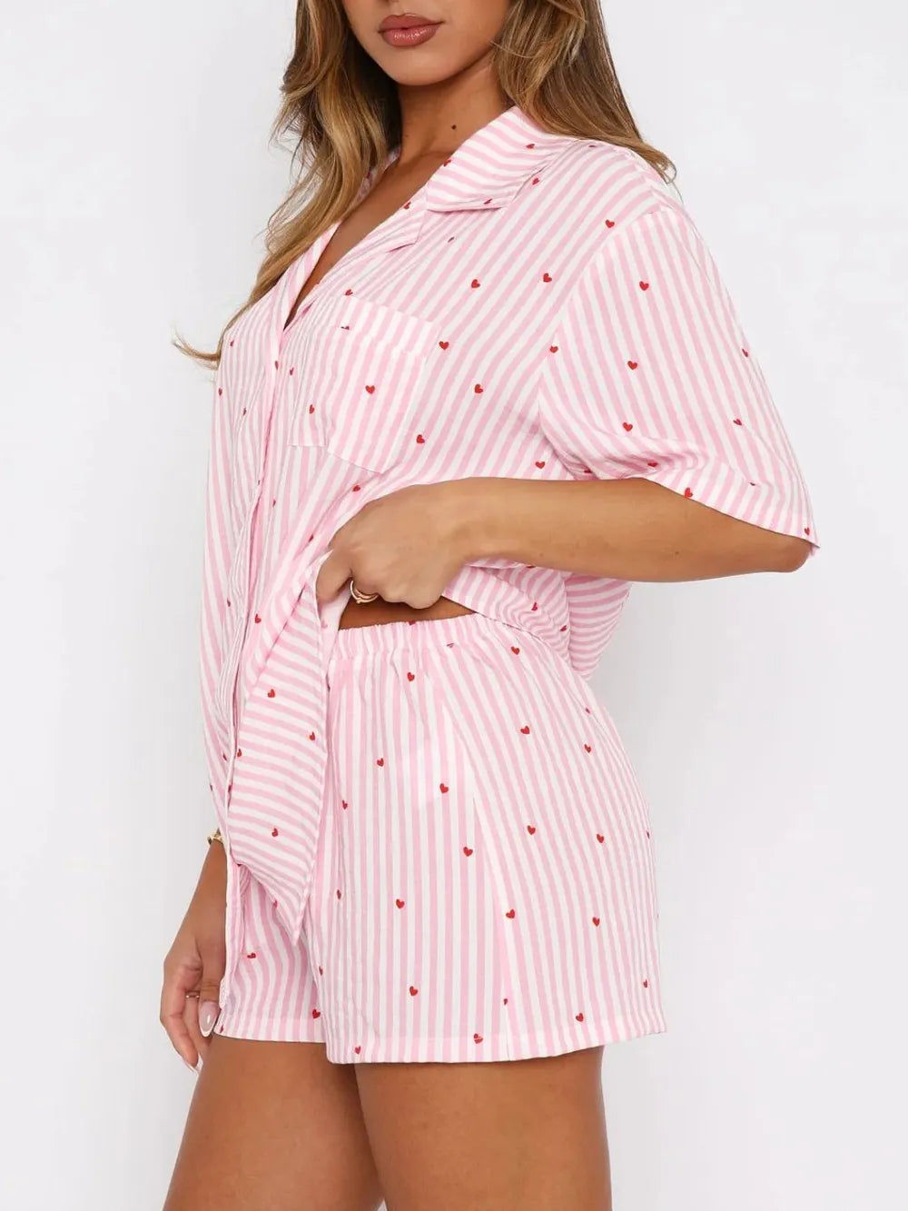 Woman wearing a Pink Pinstripe Heart Short Sleeve Top and Shorts Set