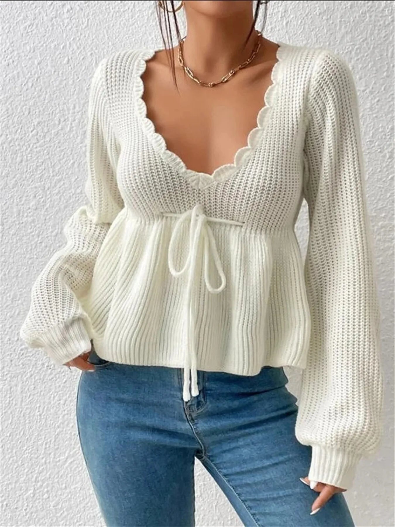 Woman Wearing a  Scalloped V-Neck Drawstring Knit Top