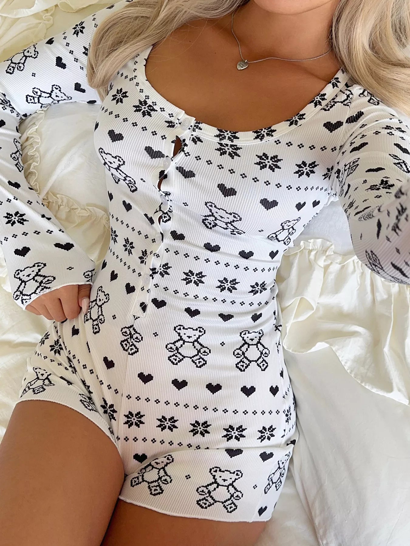 woman wearing a teddy bear printed long sleeve romper