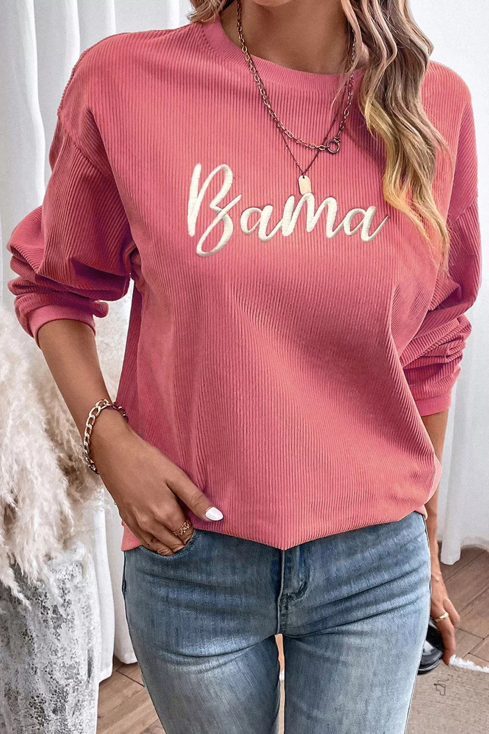 woman wearing an alabama embroidered sweatshirt