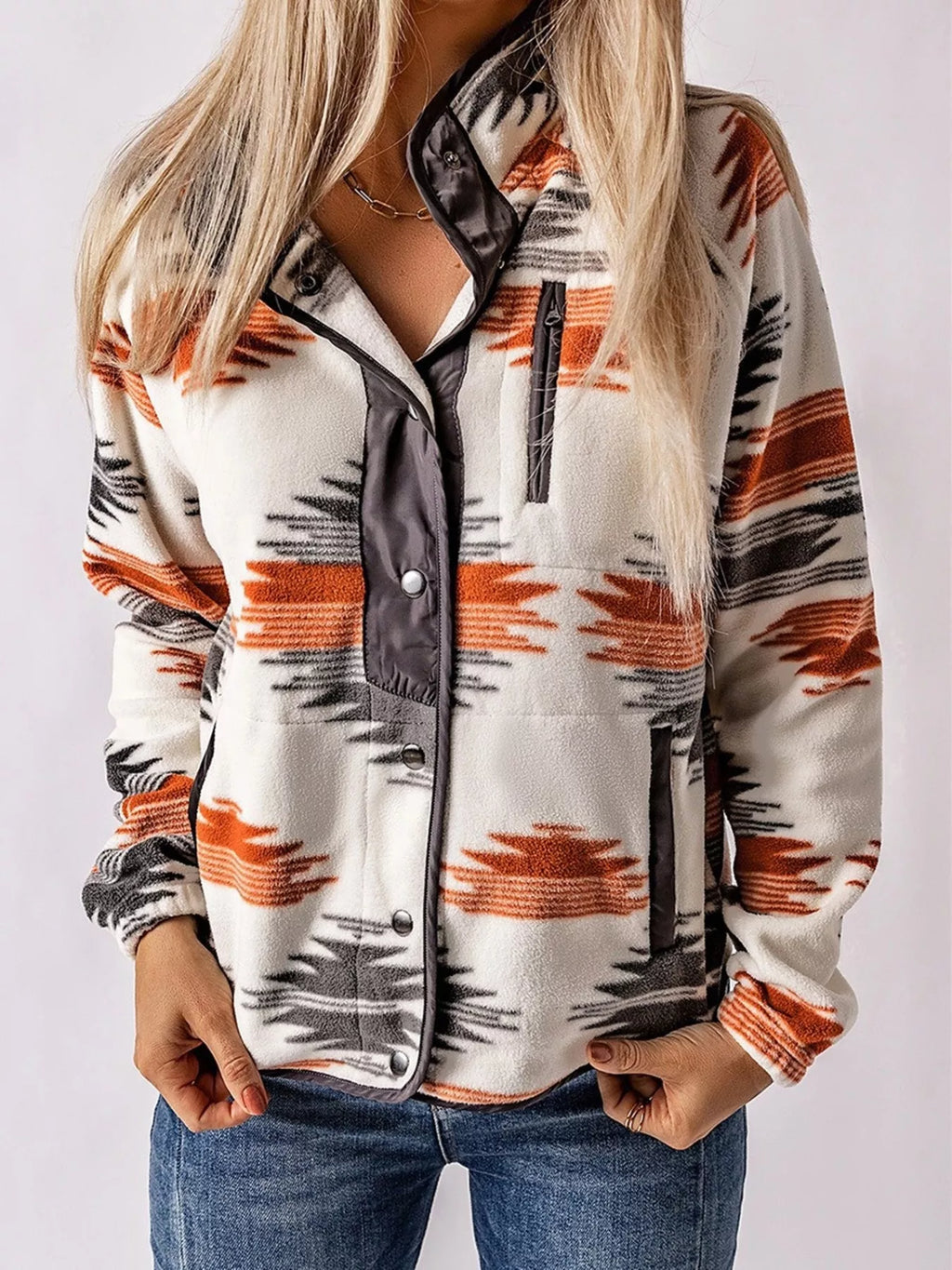 woman wearing a fleece snap down western print jacket