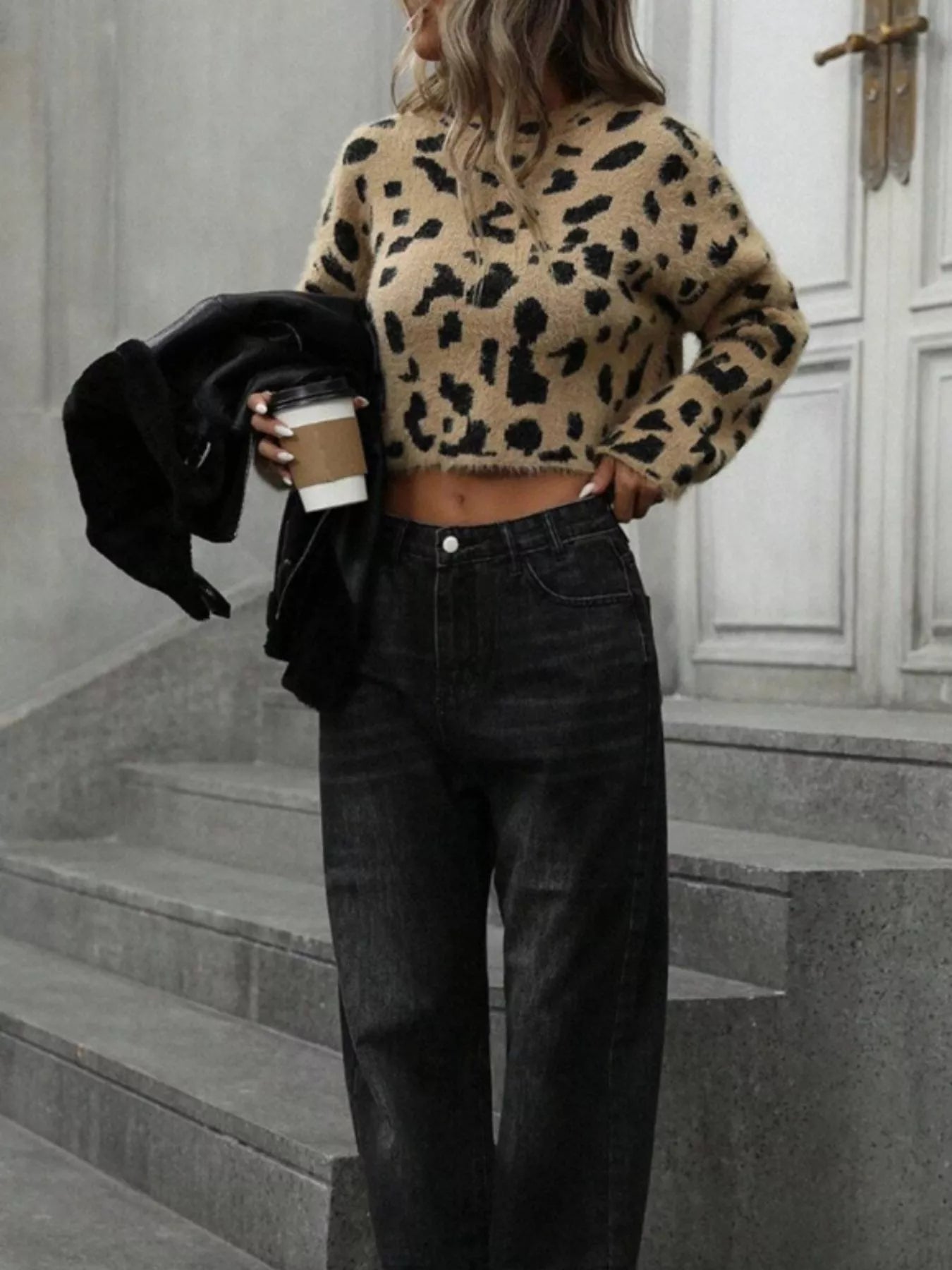 woman wearing a fuzzy animal print leopard cropped sweater