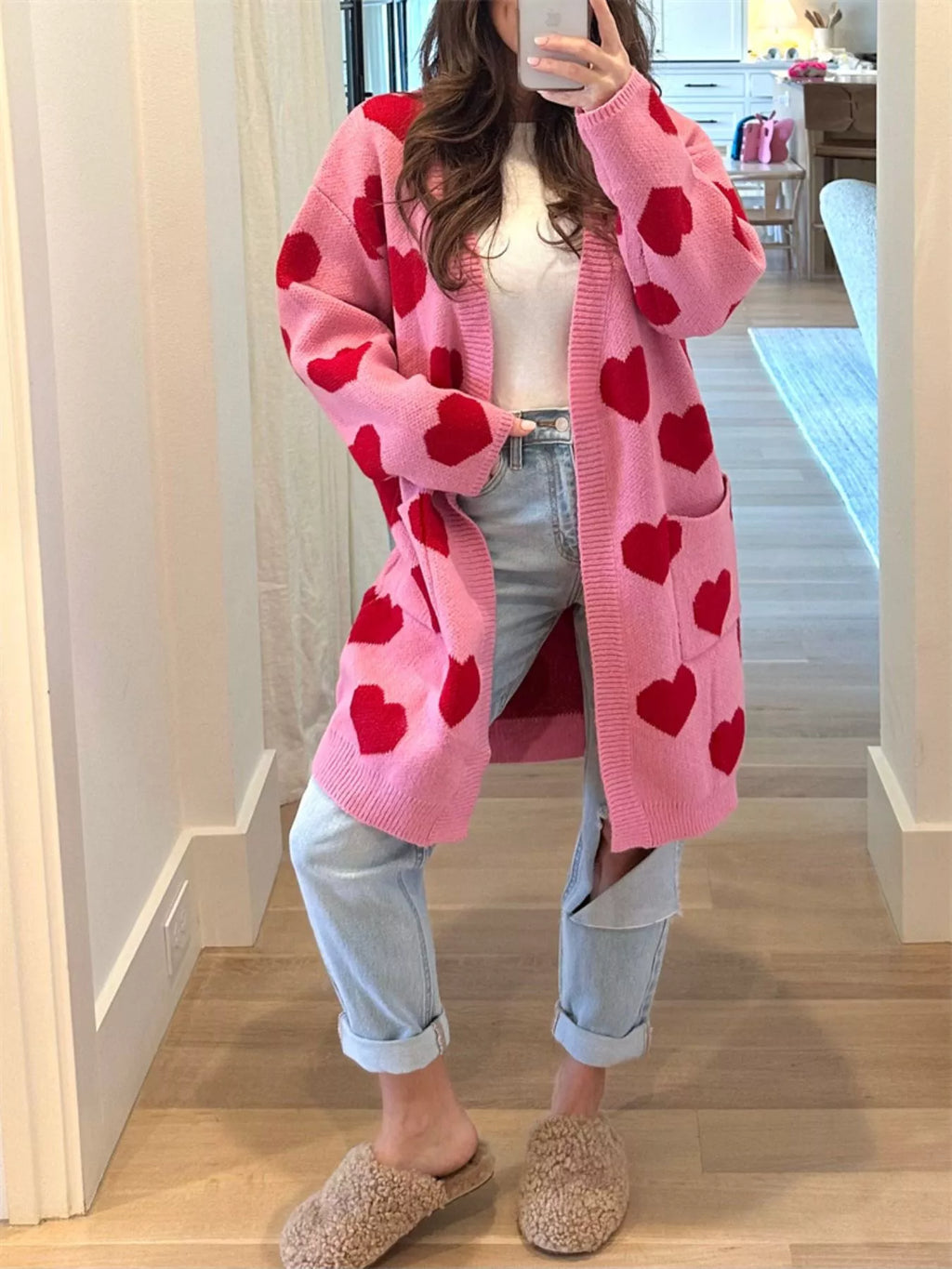 woman wearing a heart pattern cardigan