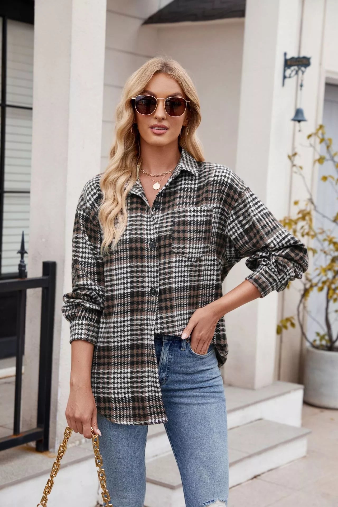 woman wearing a plaid button up long sleeve blouse