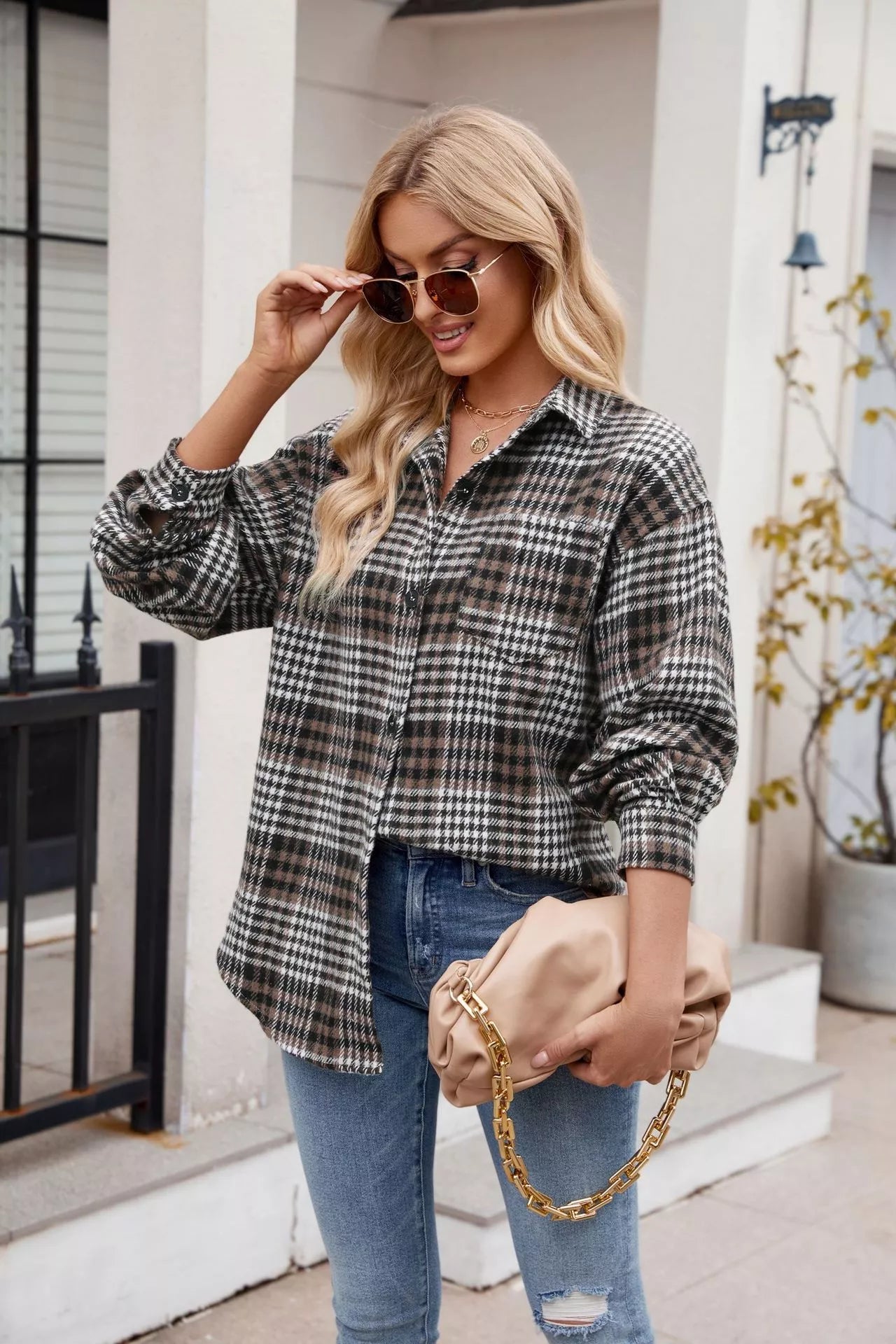 woman wearing a plaid button up top