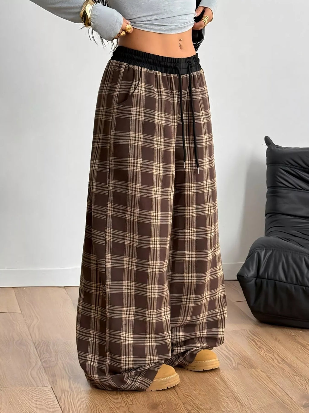 woman wearing plaid drawstring wide leg lounge pants