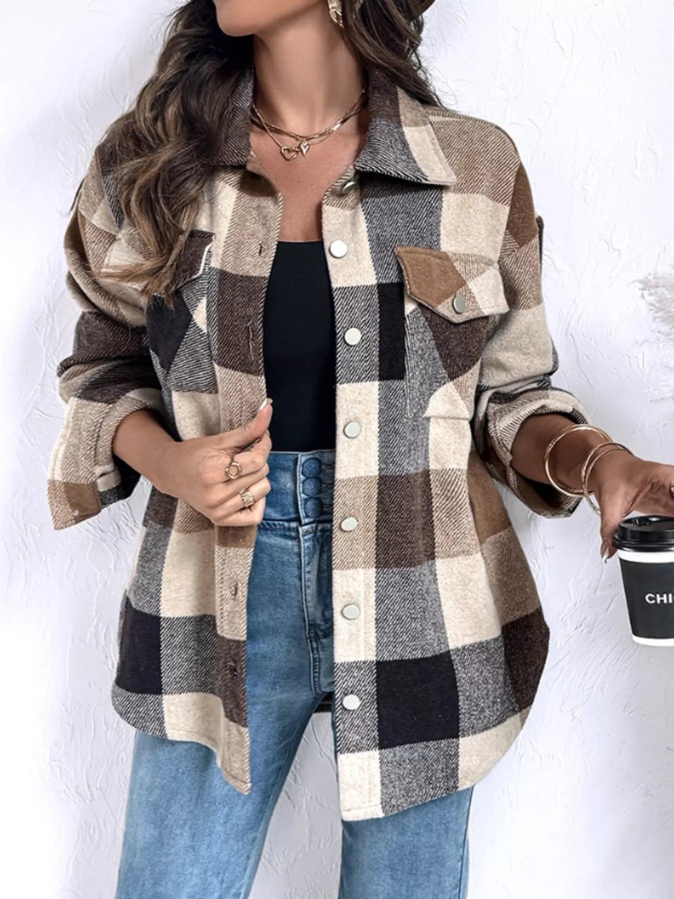 woman wearing a plaid long sleeve button up womens shirt