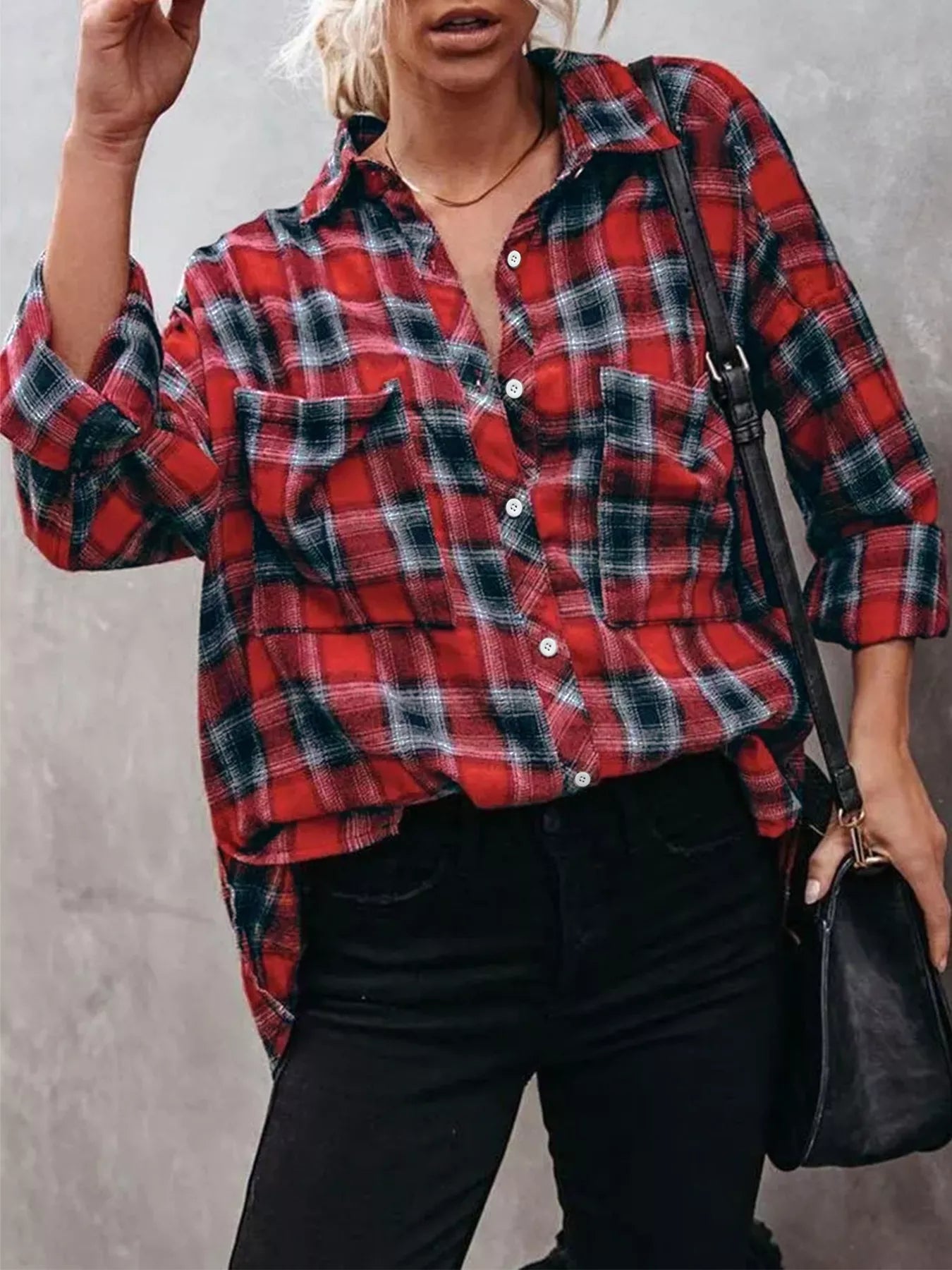 woman wearing a relaxed fit plaid button up top