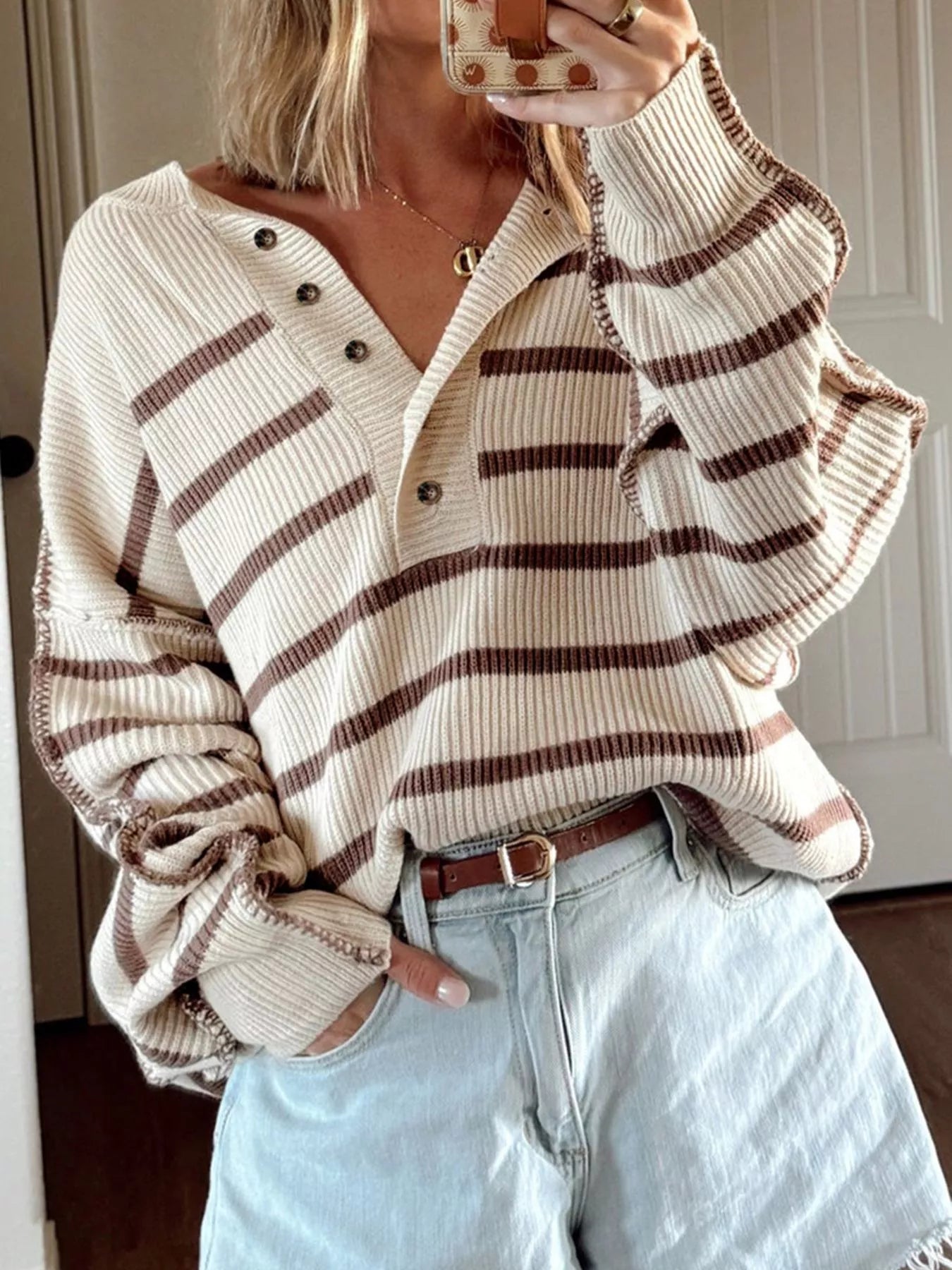 woman wearing a ribbed striped relax fit sweater