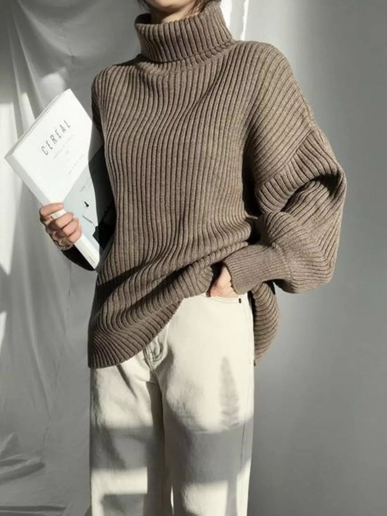 woman wearing an oversized ribbed turtleneck sweater