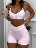 woman wearing a matching two piece ruched activewear set