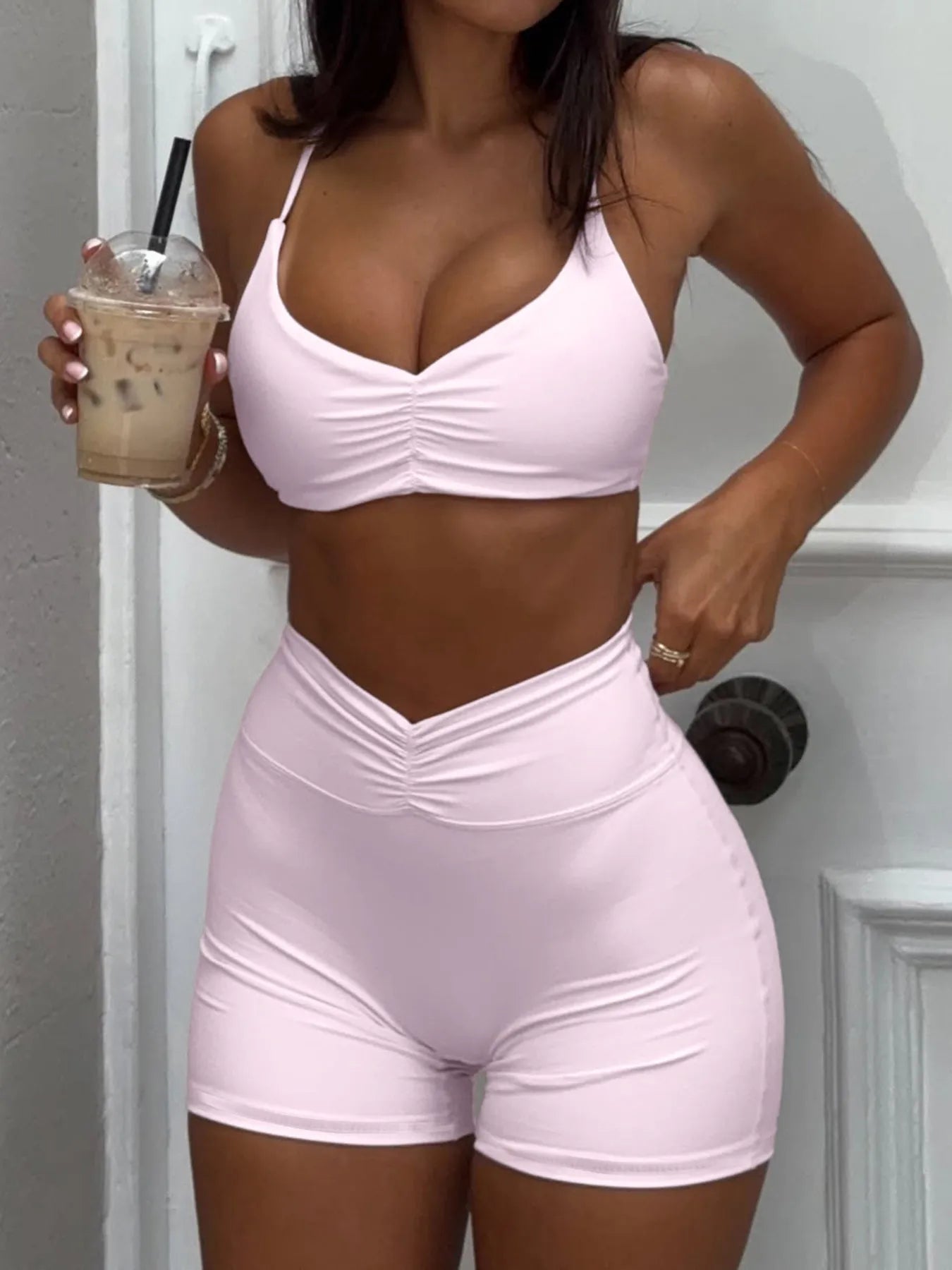 woman wearing a matching two piece ruched activewear set