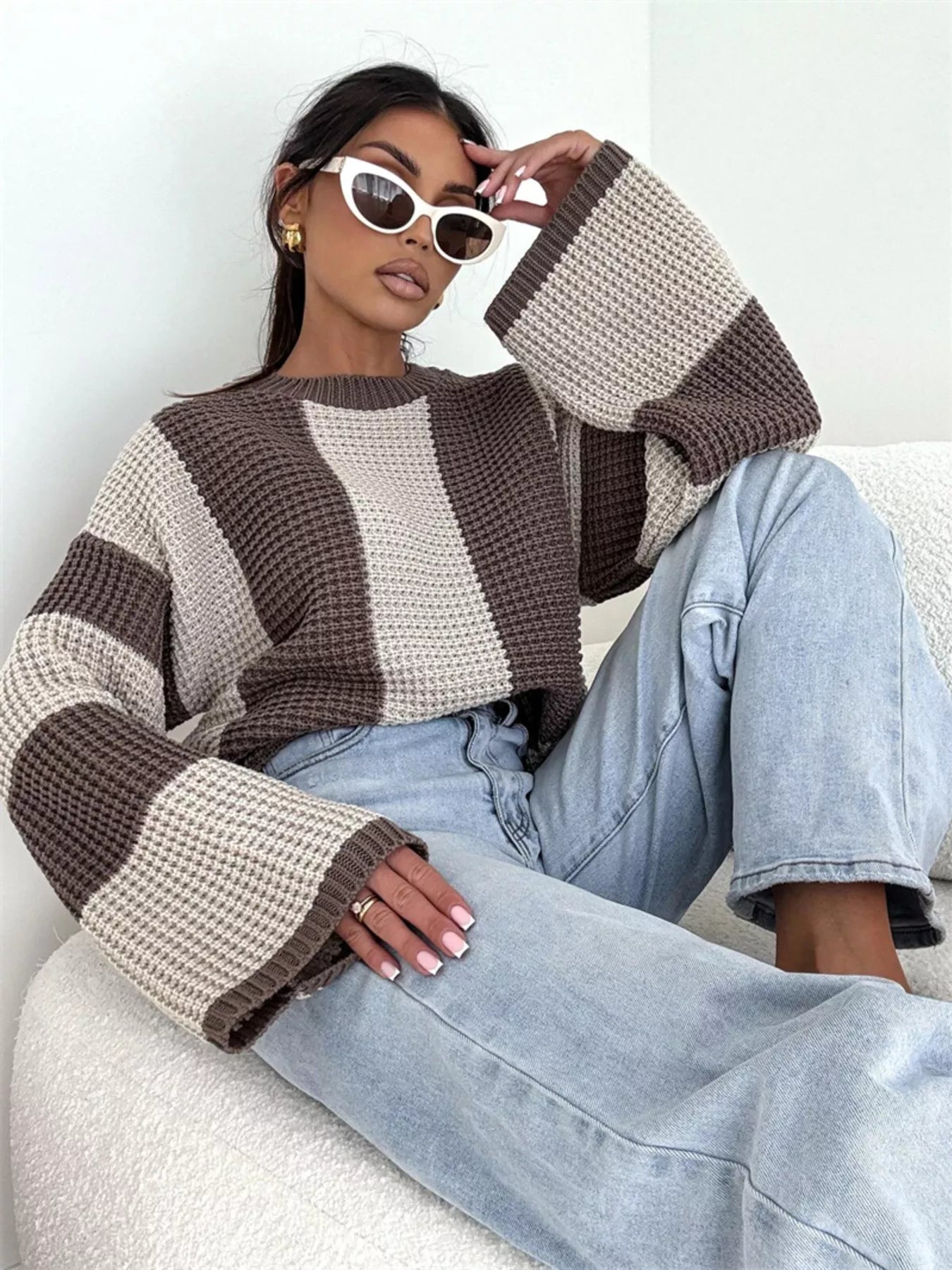 woman wearing a striped color block sweater