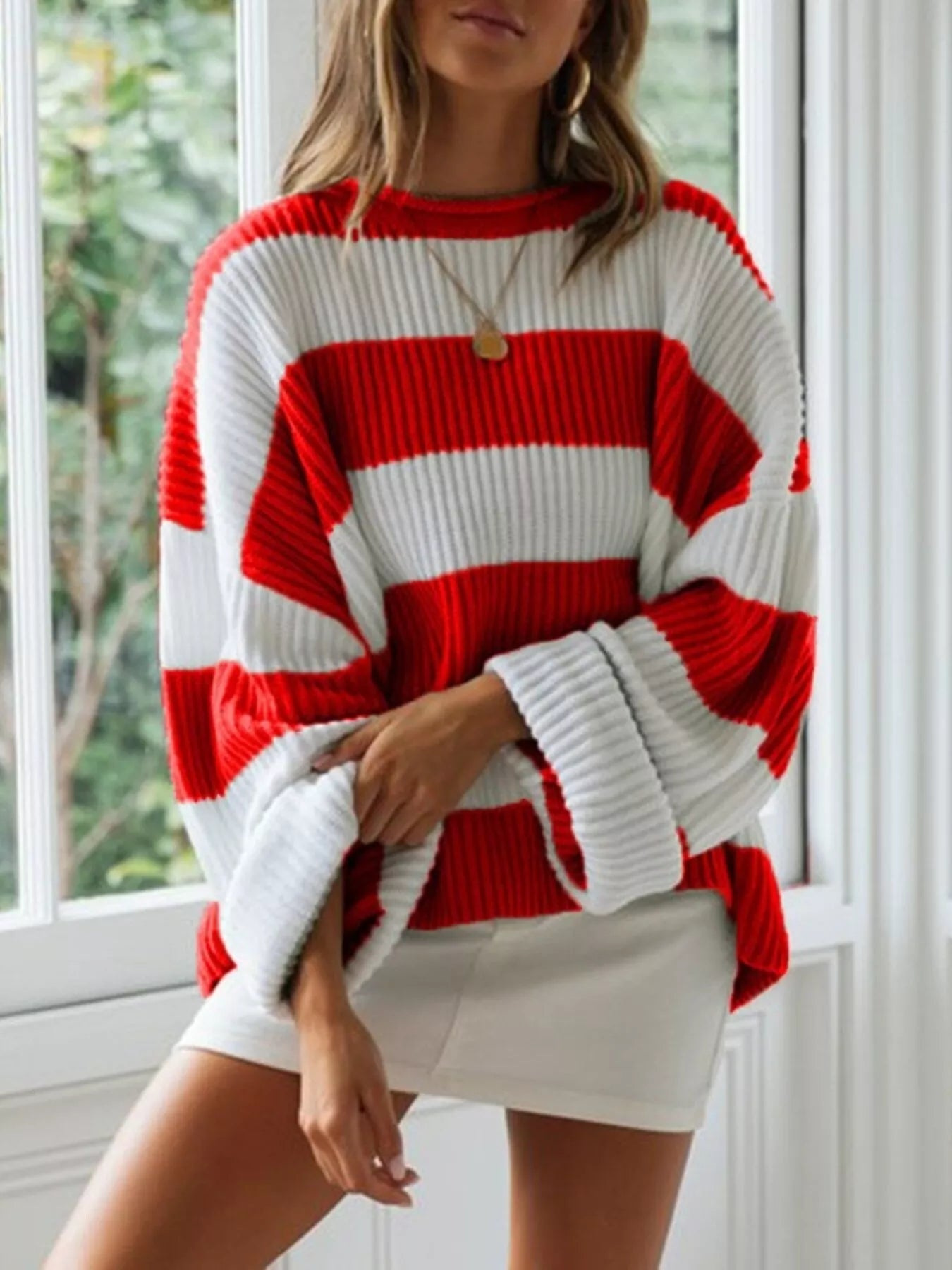 woman wearing a ribbed striped contrast round neck sweater