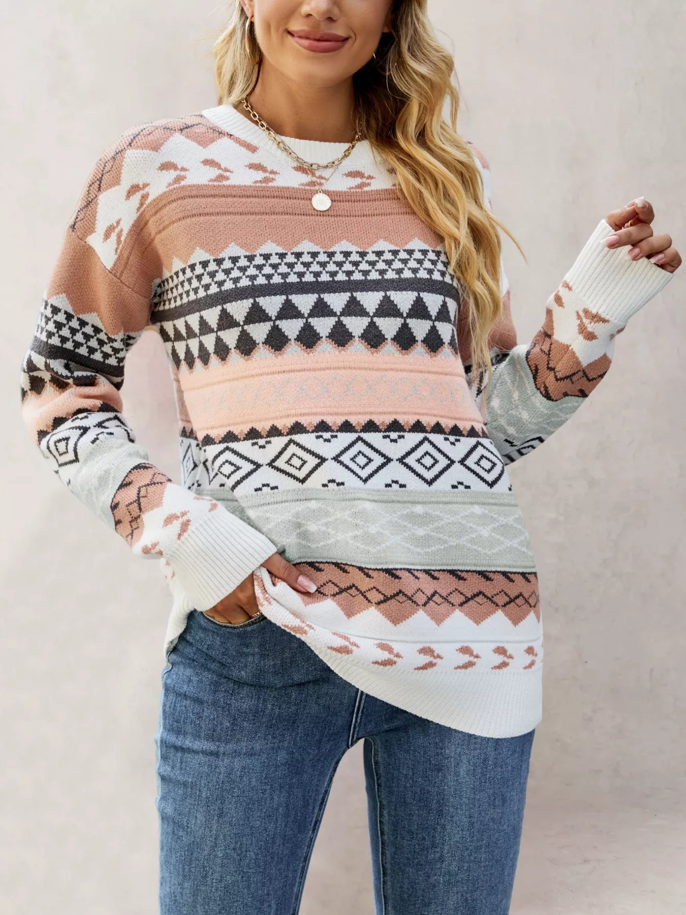 woman wearing a striped geometric print knit sweater