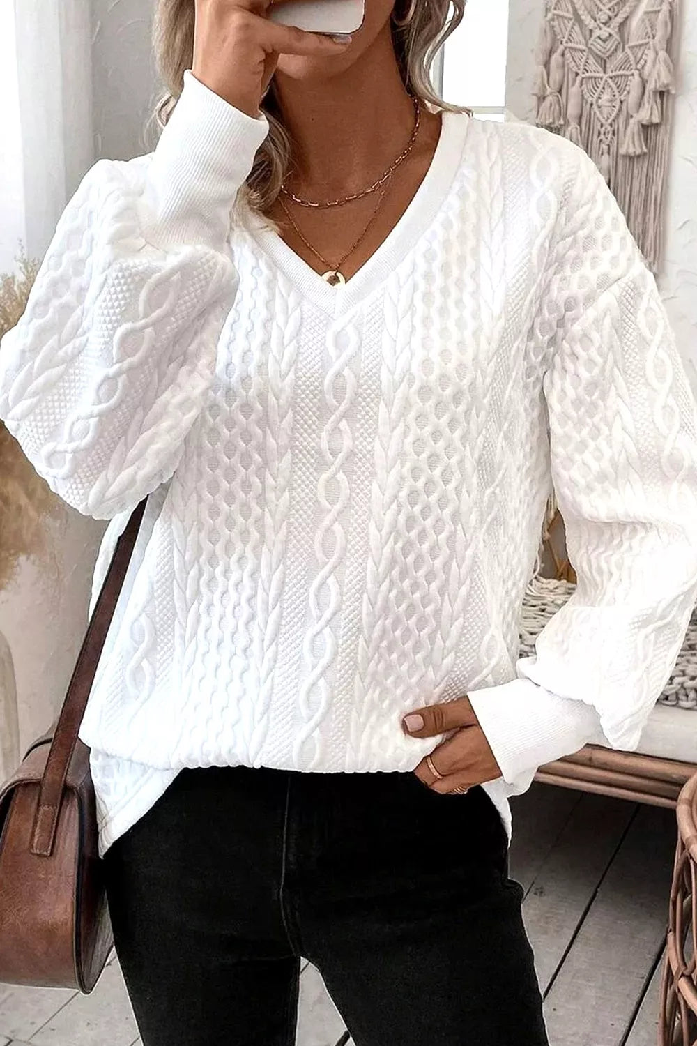 woman wearing a texture white v neck sweater