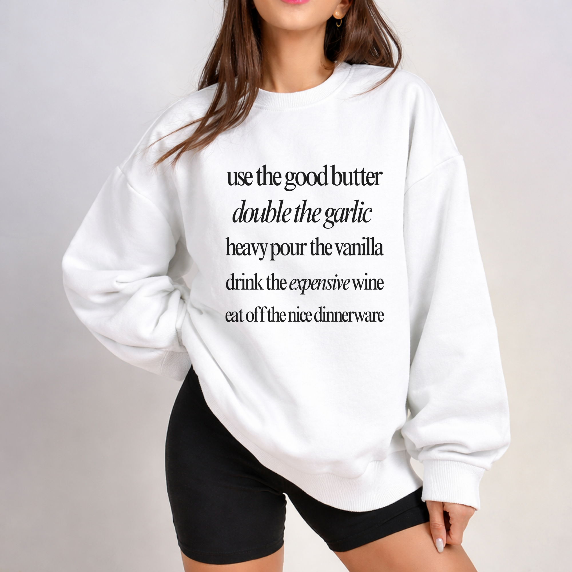 woman wearing a modern quot cooking sweatshirt that says use the good butter etc.