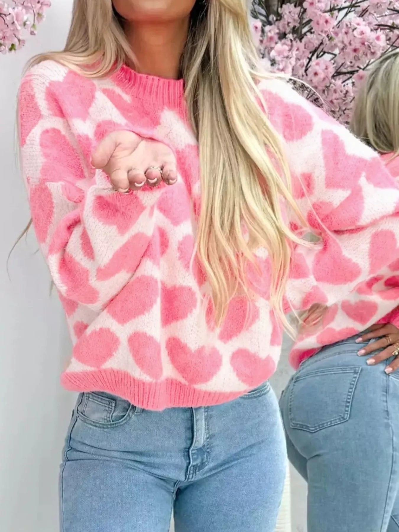woman wearing a sweater with white and pink heart pattern